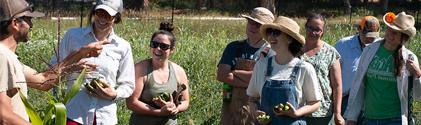 Farming students being instructed by a faculty member